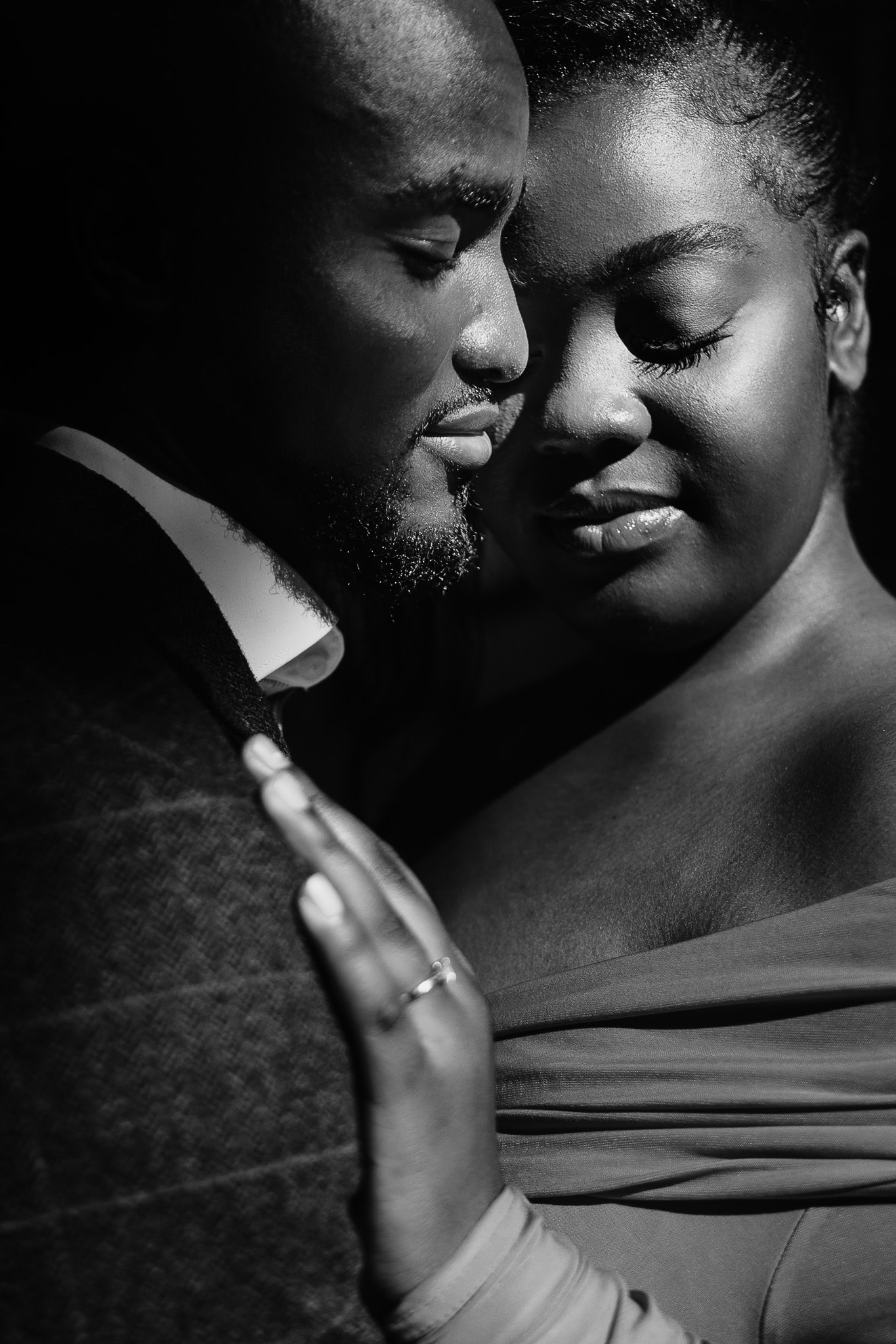 Intimate pre-wedding shoot portrait of a couple embracing.
