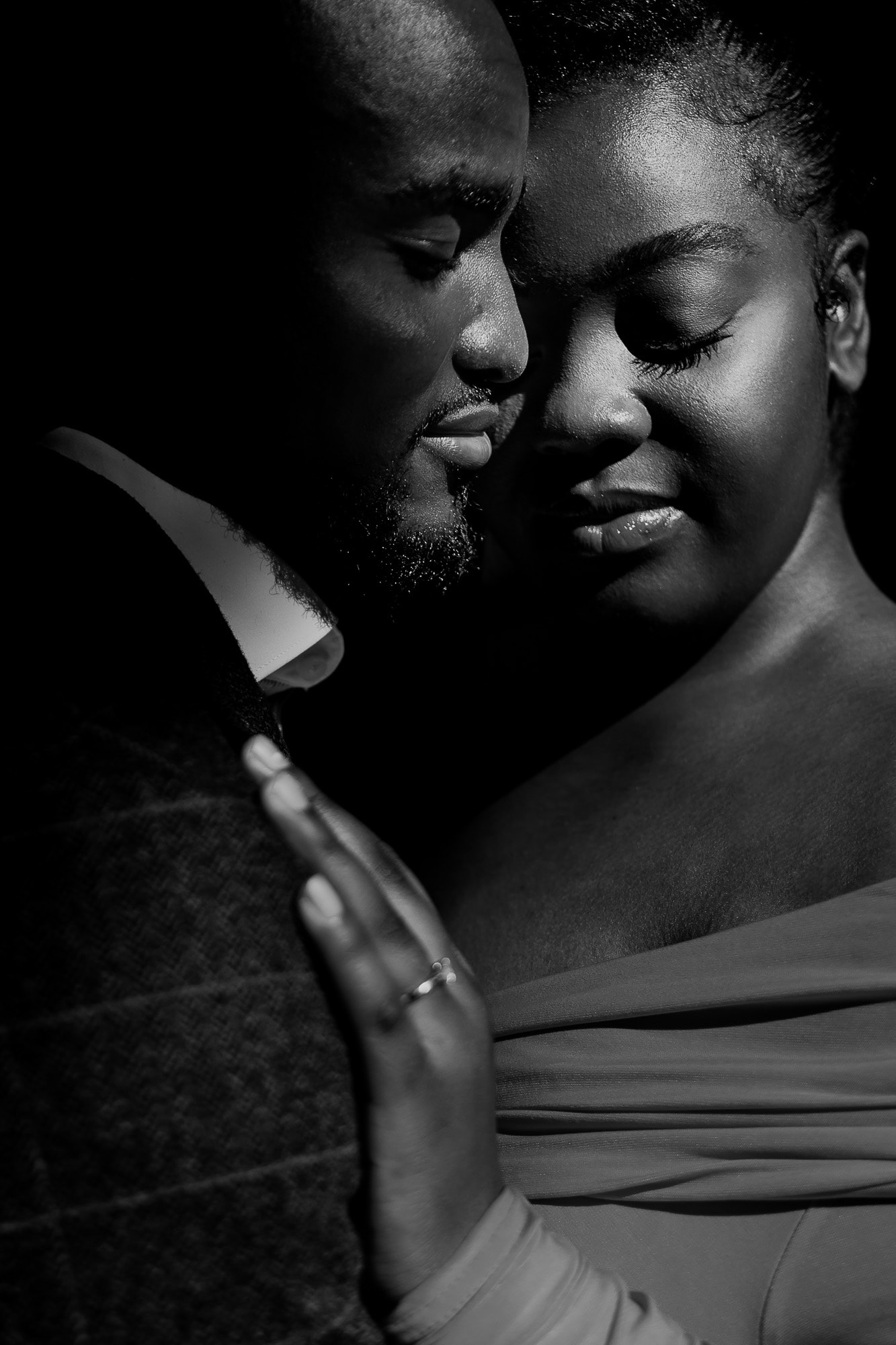 Black and White portrait of Bride & Groom in the hard light of day.