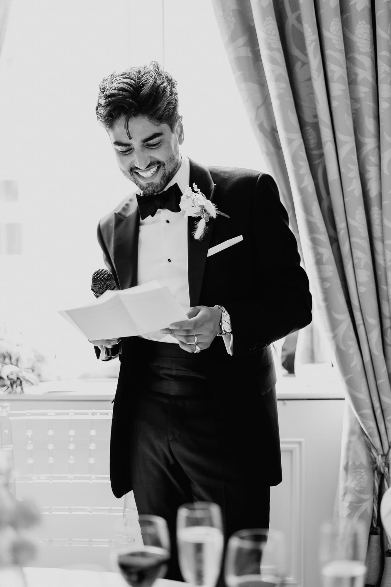 Groom giving wedding speech, a part of wedding photography portfolio.