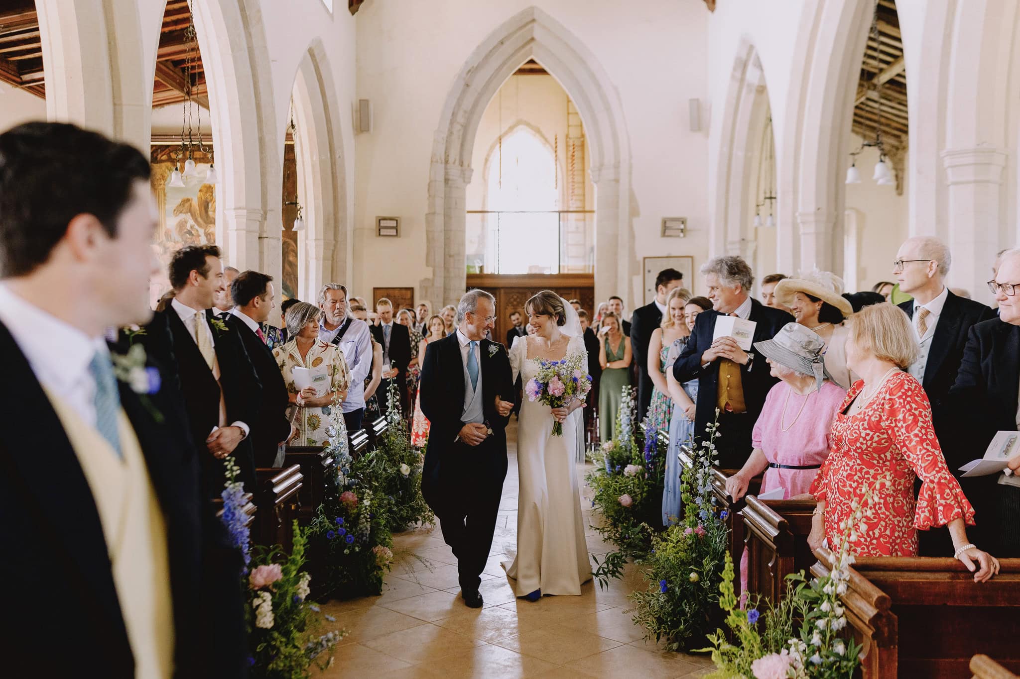 Bride walks down aisle with father, part of a Wedding Photography Portfolio