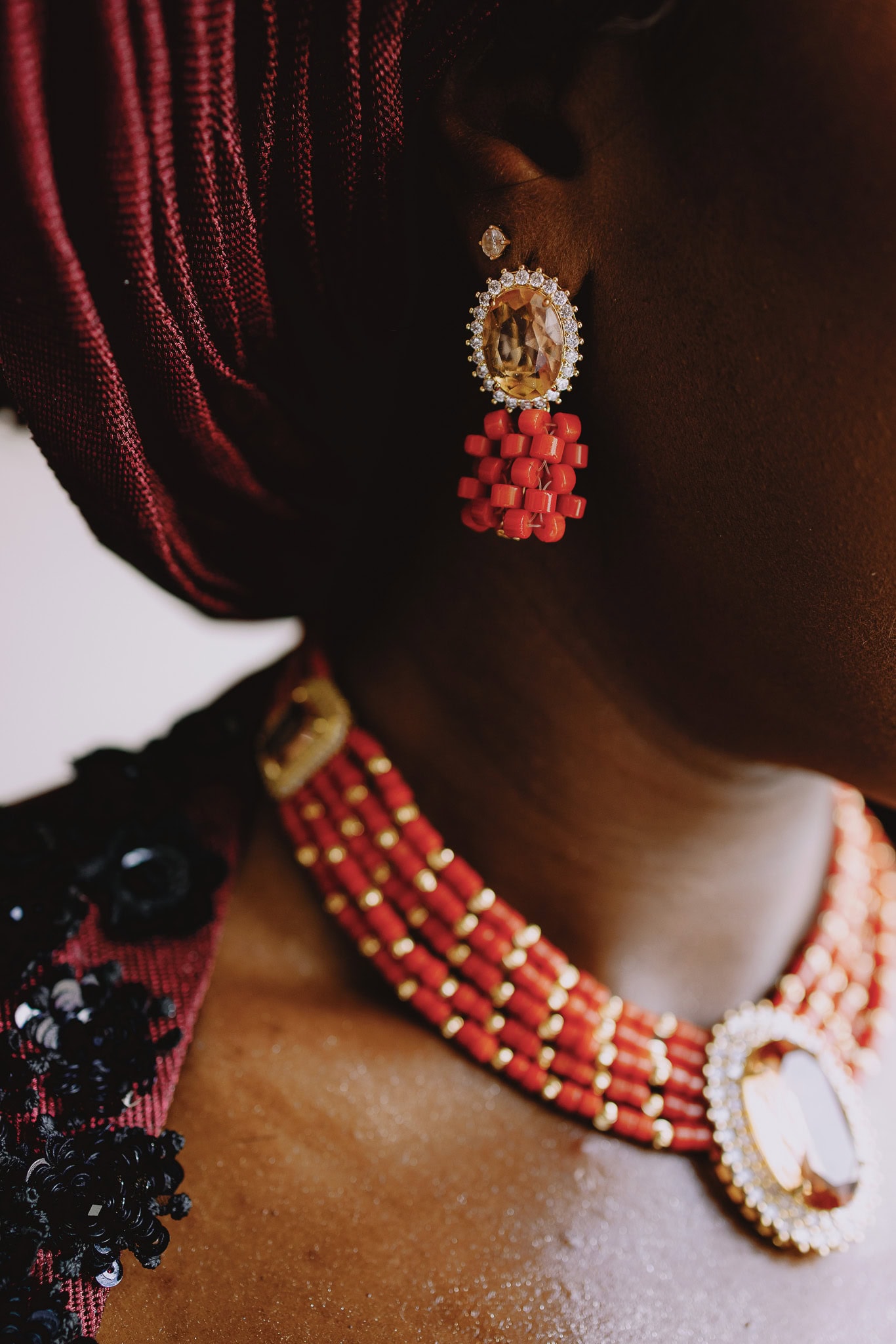 Elegant wedding jewelry: coral beads, gemstone earrings and necklace.