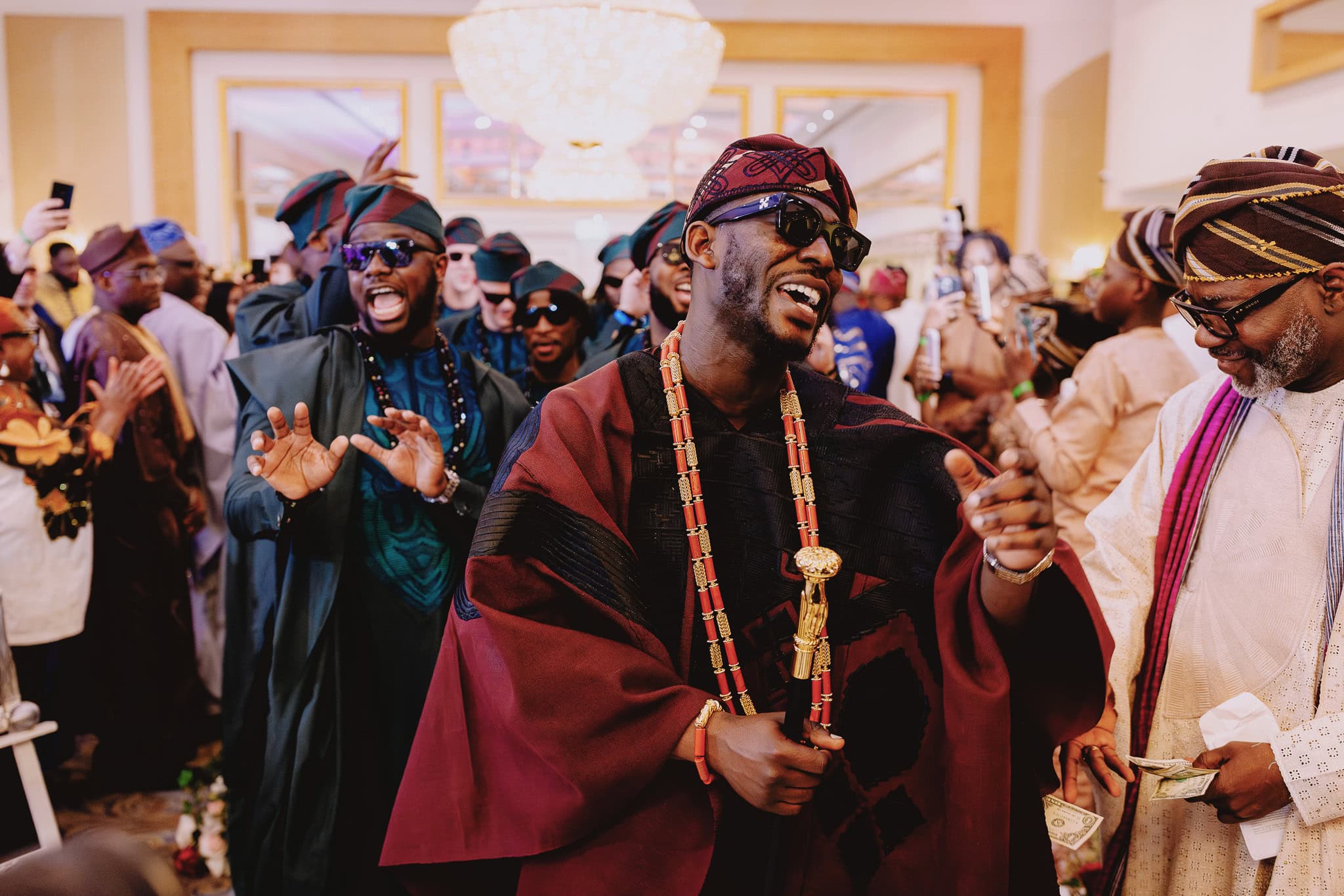 Groom dips bride in a romantic wedding photography pose at sunset.