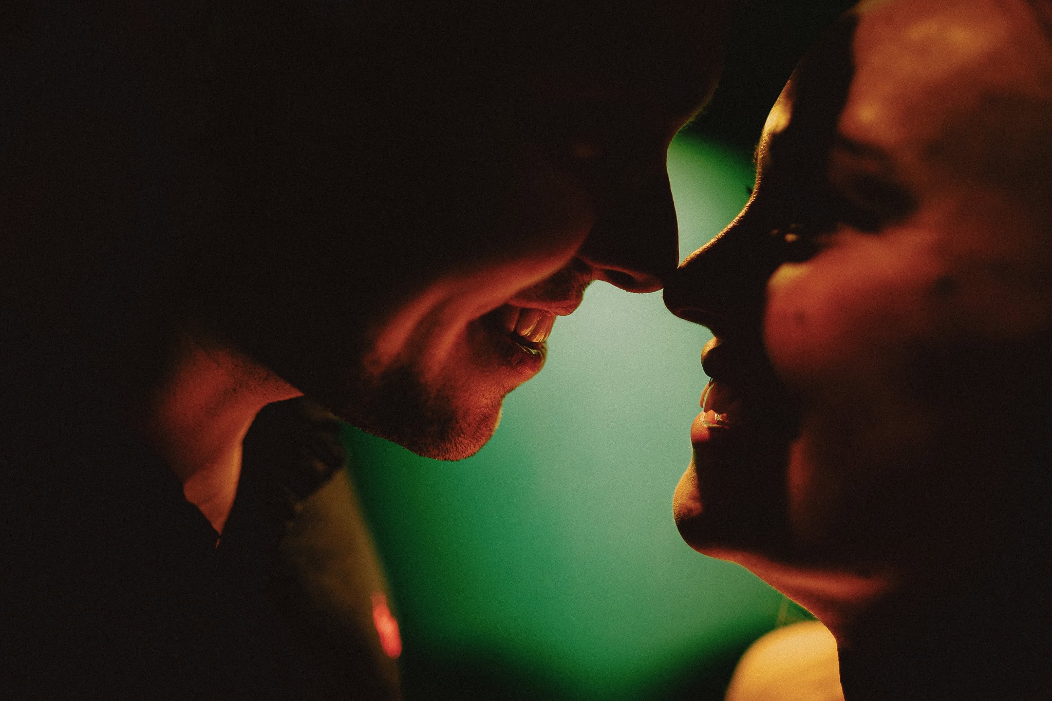 Close-up of a couple about to kiss, showcasing wedding photography portfolio.