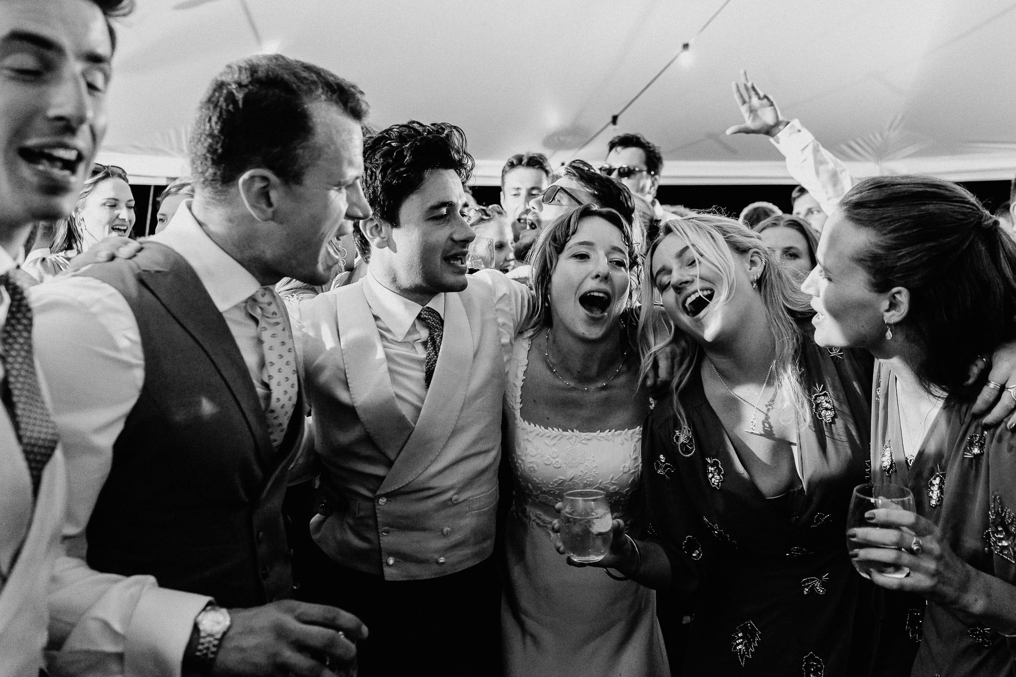 Joyful wedding party celebrating. Wedding Photography Portfolio image.