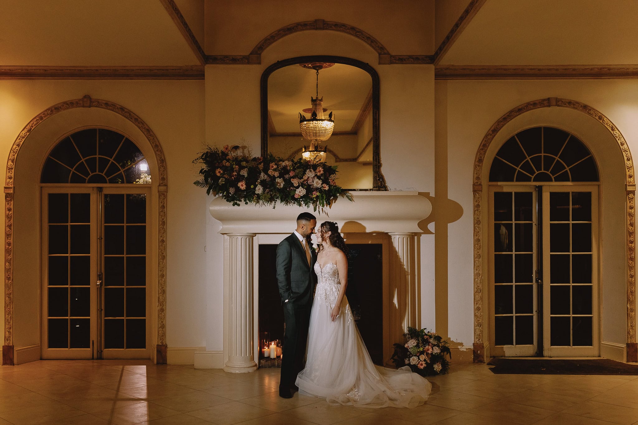 Couple embracing in elegant wedding venue, wedding photography portfolio.