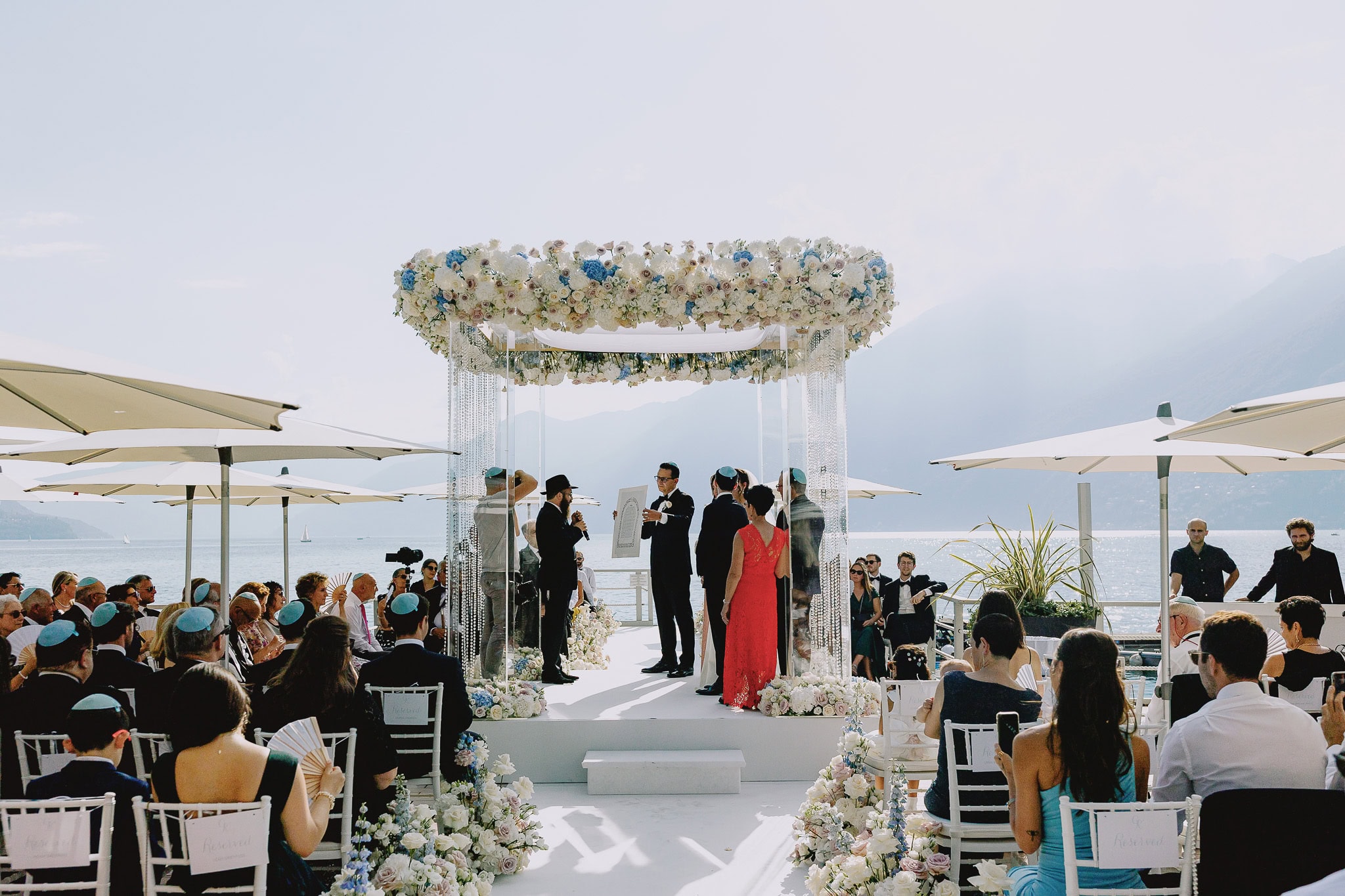 Lake Como destination wedding ceremony with floral chuppah.