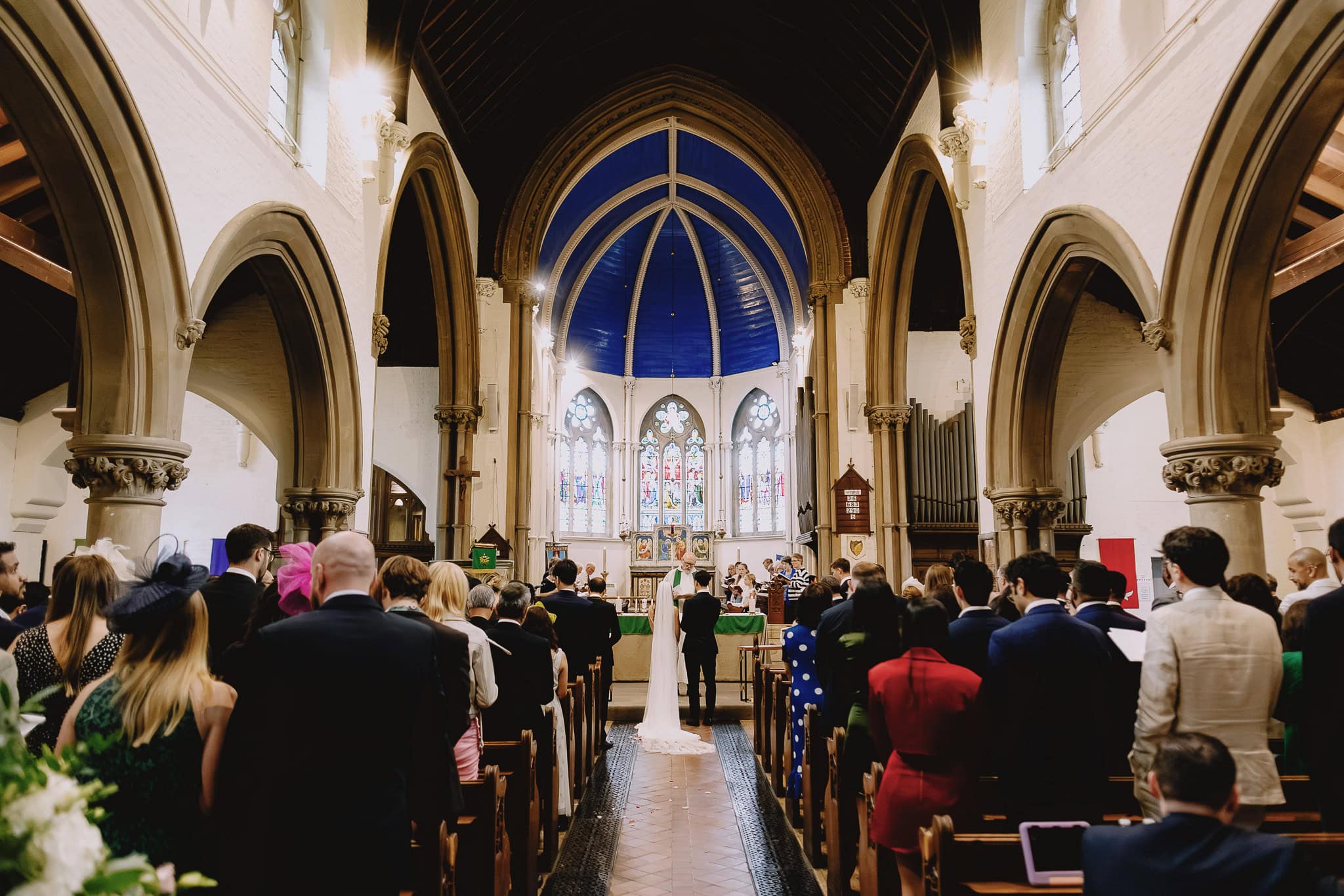 Wedding ceremony in a beautiful church with guests.